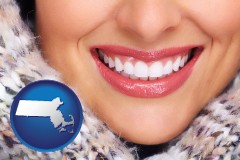 massachusetts map icon and beautiful white teeth forming a beautiful smile
