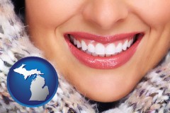 michigan map icon and beautiful white teeth forming a beautiful smile