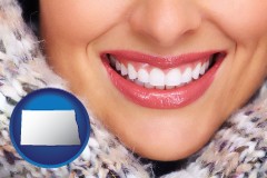 north-dakota map icon and beautiful white teeth forming a beautiful smile