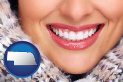 nebraska map icon and beautiful white teeth forming a beautiful smile
