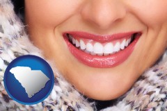 south-carolina map icon and beautiful white teeth forming a beautiful smile
