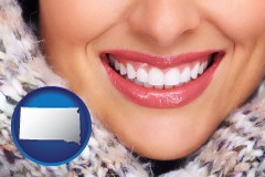 south-dakota map icon and beautiful white teeth forming a beautiful smile