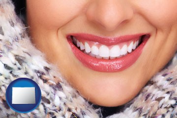 beautiful white teeth forming a beautiful smile - with Colorado icon