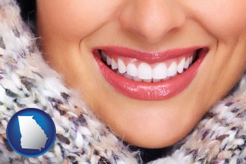 beautiful white teeth forming a beautiful smile - with Georgia icon