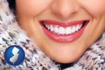 beautiful white teeth forming a beautiful smile - with New Jersey icon