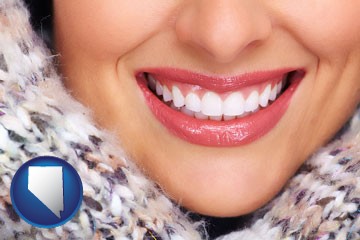beautiful white teeth forming a beautiful smile - with Nevada icon