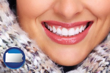 beautiful white teeth forming a beautiful smile - with Pennsylvania icon