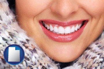beautiful white teeth forming a beautiful smile - with Utah icon
