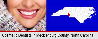 beautiful white teeth forming a beautiful smile; Mecklenburg County highlighted in red on a map