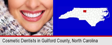 beautiful white teeth forming a beautiful smile; Guilford County highlighted in red on a map